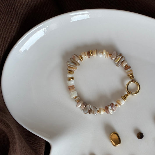 Close-up of natural freshwater shell beads and gold accents on the Sunday Shell Bracelet