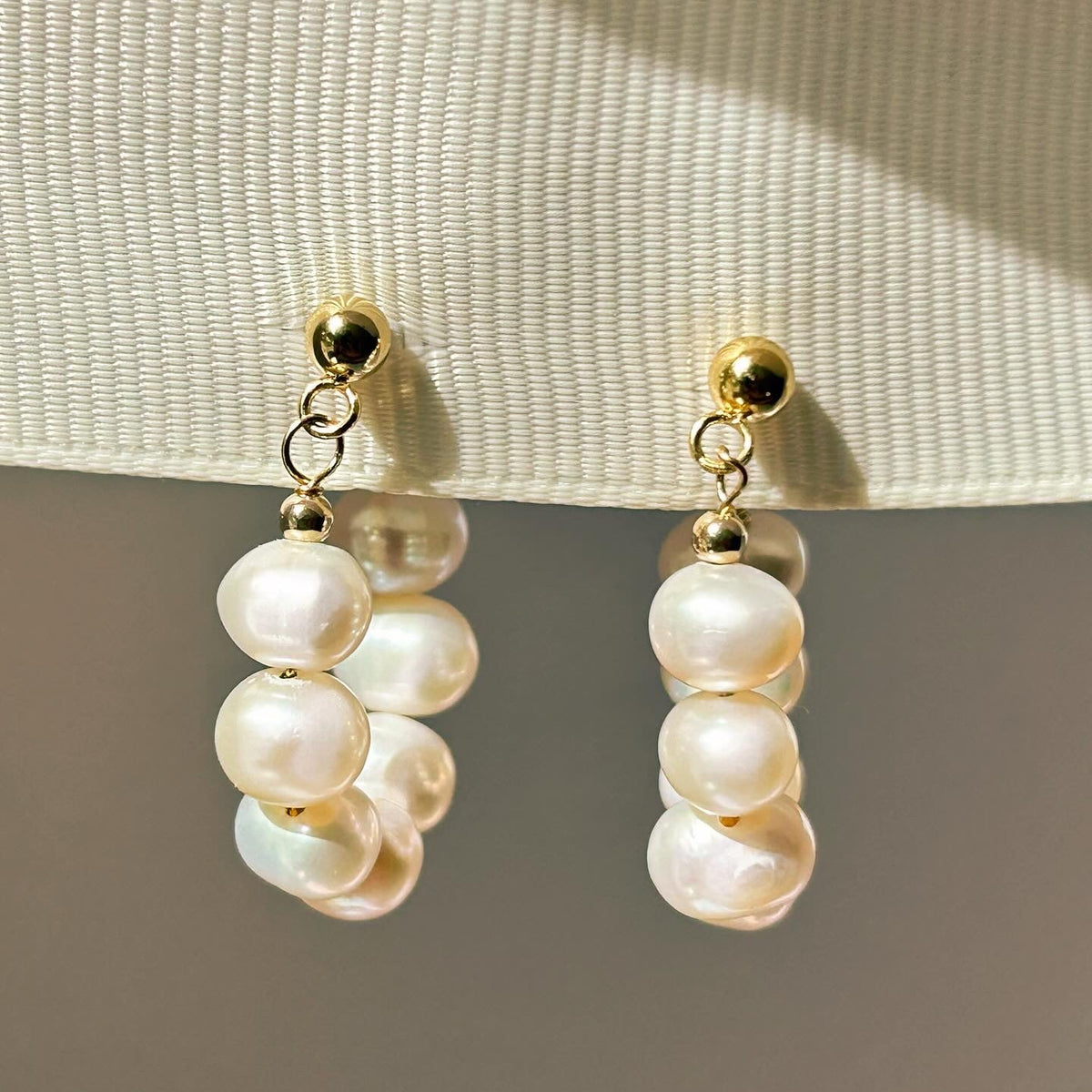 Ariel Pearl Hoops featuring hand-strung 4–5 mm freshwater pearls on gold hoops, handmade by Isla Rae Jewelry in Saskatchewan.