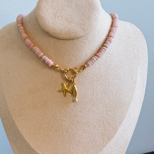 pink opal semi precious stones with golden accents. front closure with added charms. meaningful jewelry 