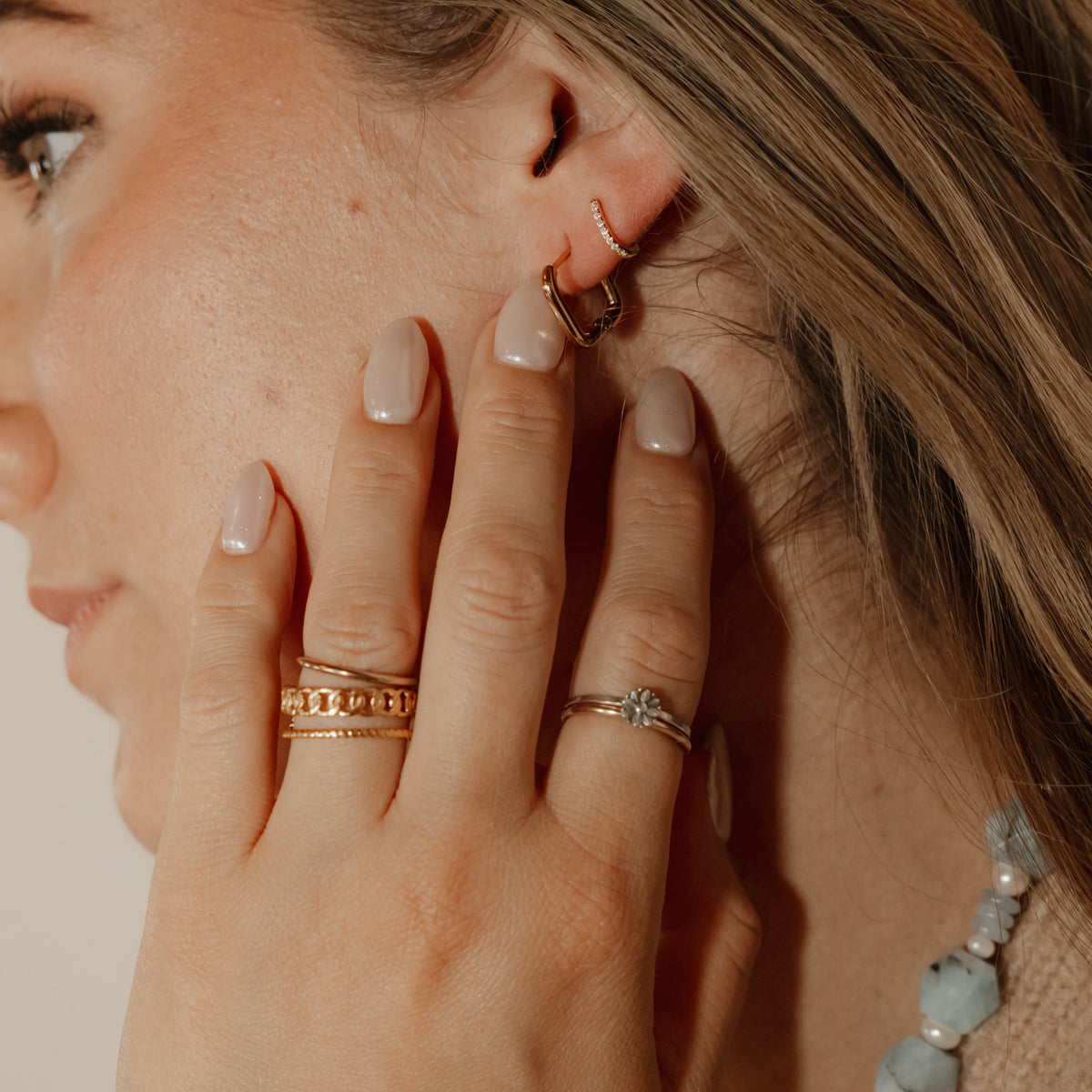 Close-up of Regan 18K gold-plated sterling silver hoops with pavé cubic zirconia