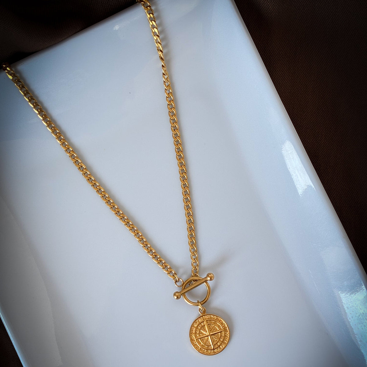 Sarah gold compass necklace with toggle clasp