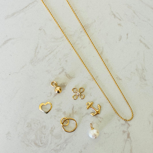 gold necklace with charms