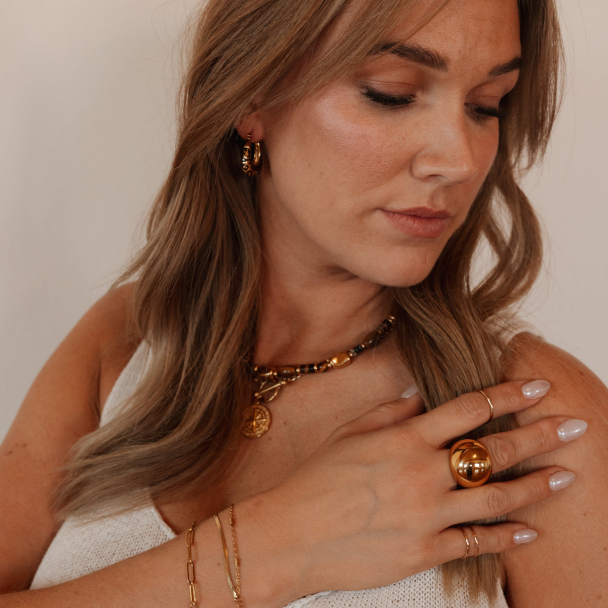 Kate chunky gold dome ring styled on model